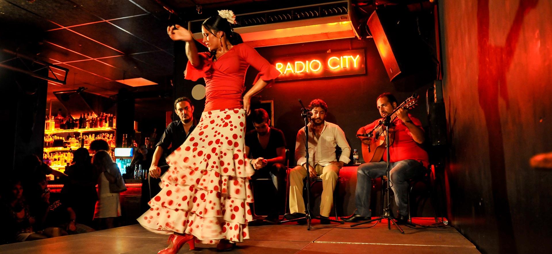 Jess' photo of a flamenco dancer on stage with musicians