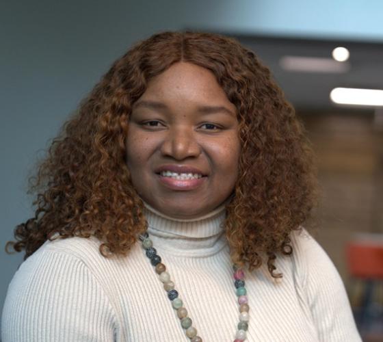 International student posed and smiling at the camera