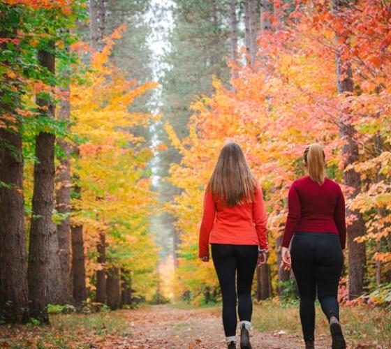 Two women walking on a trail at Hiawatha