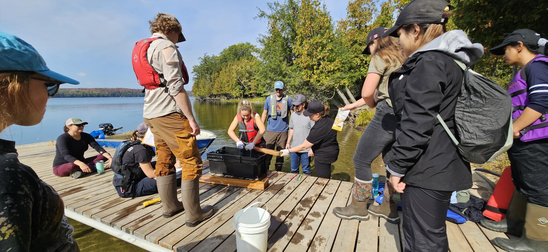 Fish and Wildlife students on a dock after fishing