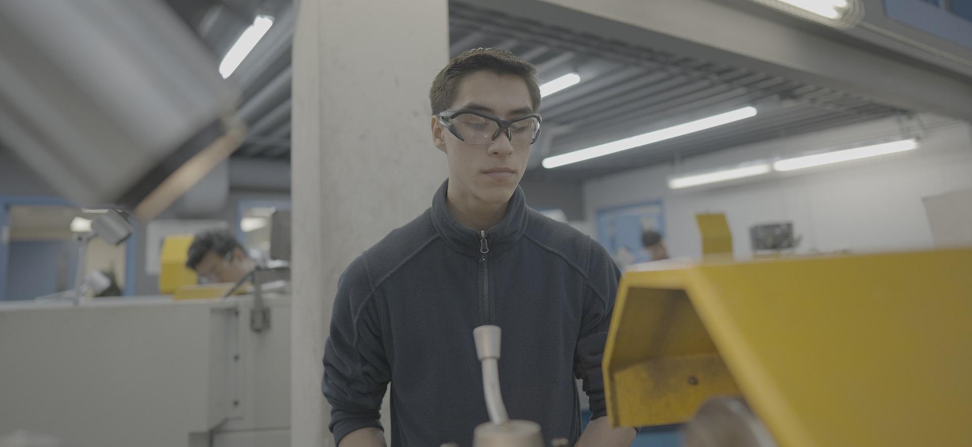 Student working on equipment in the Machine Shop