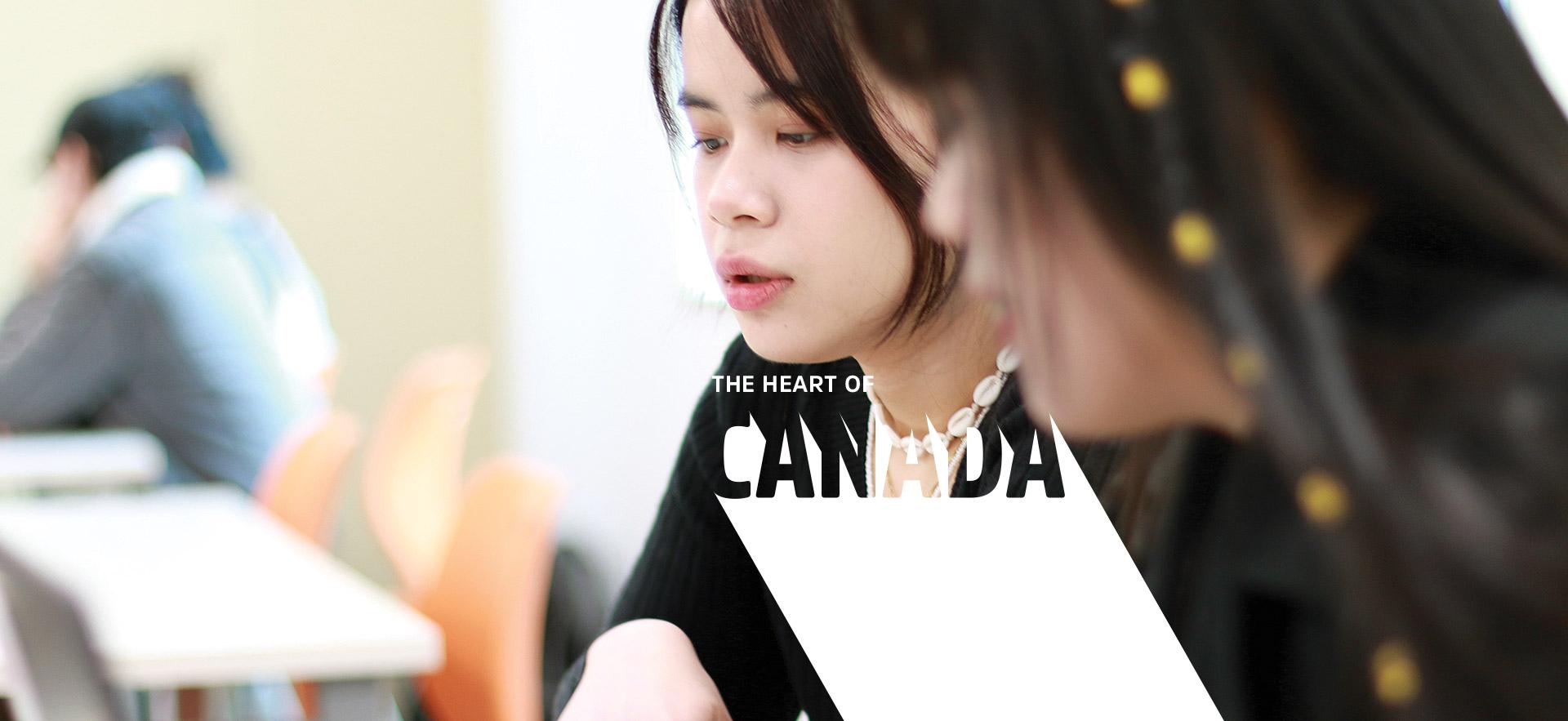 two students looking at computer screen