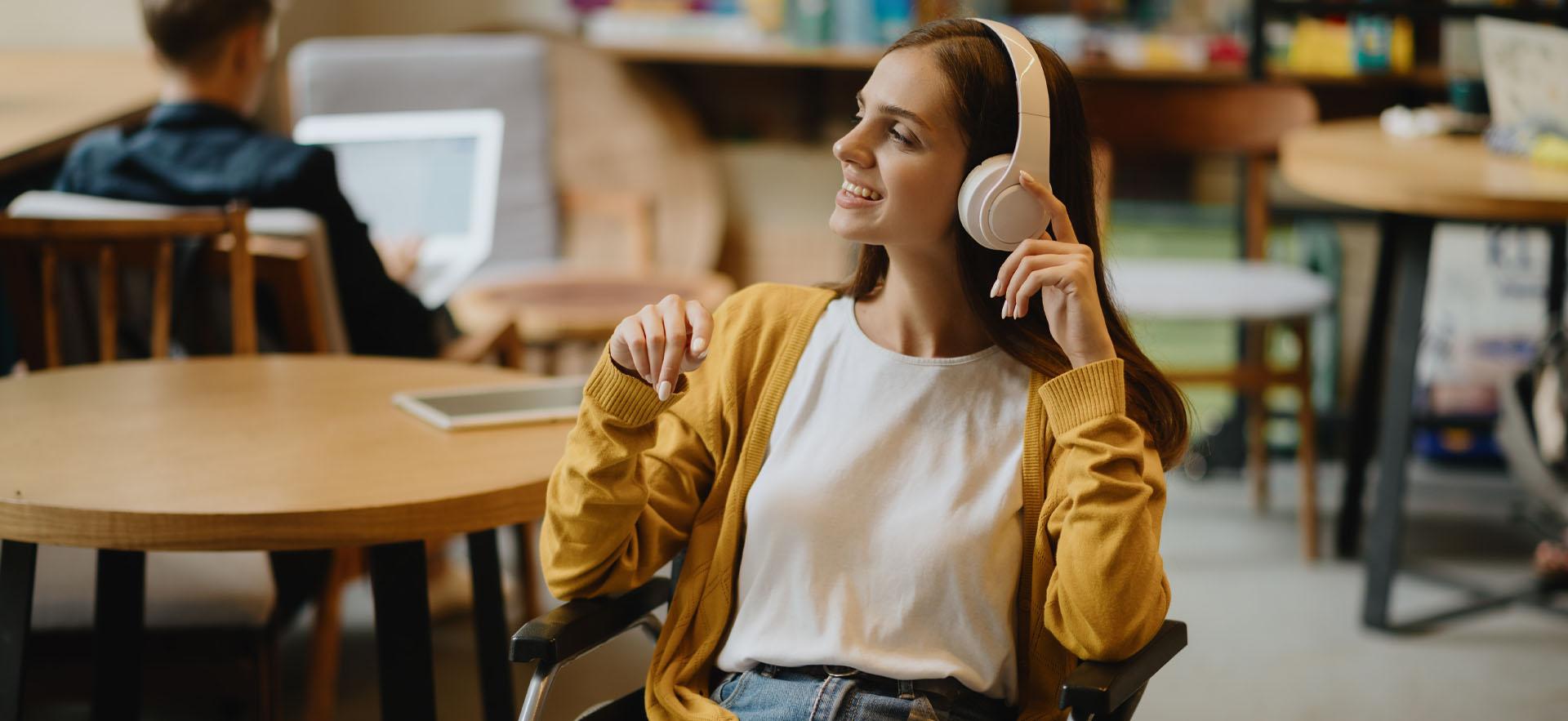 Student sitting with headphones on