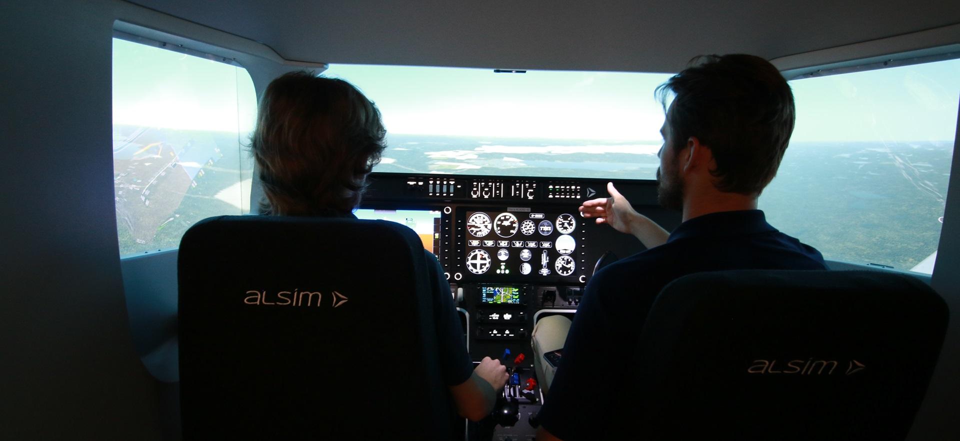 Aviation student with instructor in Alsim flight simulator