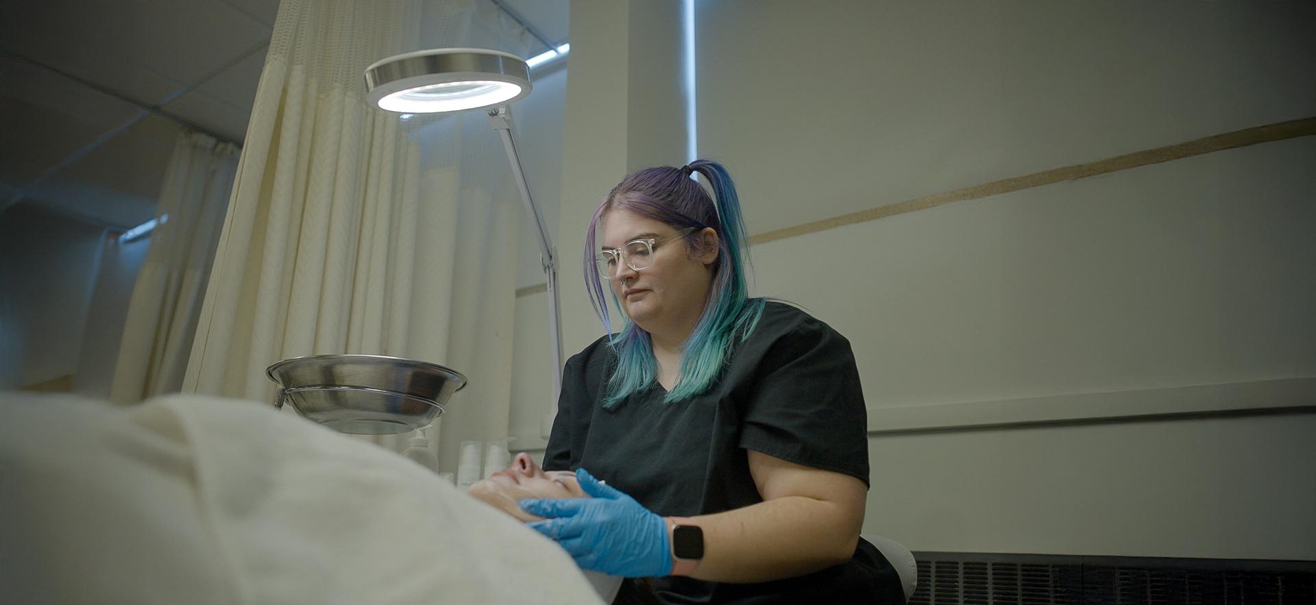 CICE student completing a facial in the spa