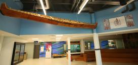 indigenous crafted canoe suspended in hall entry