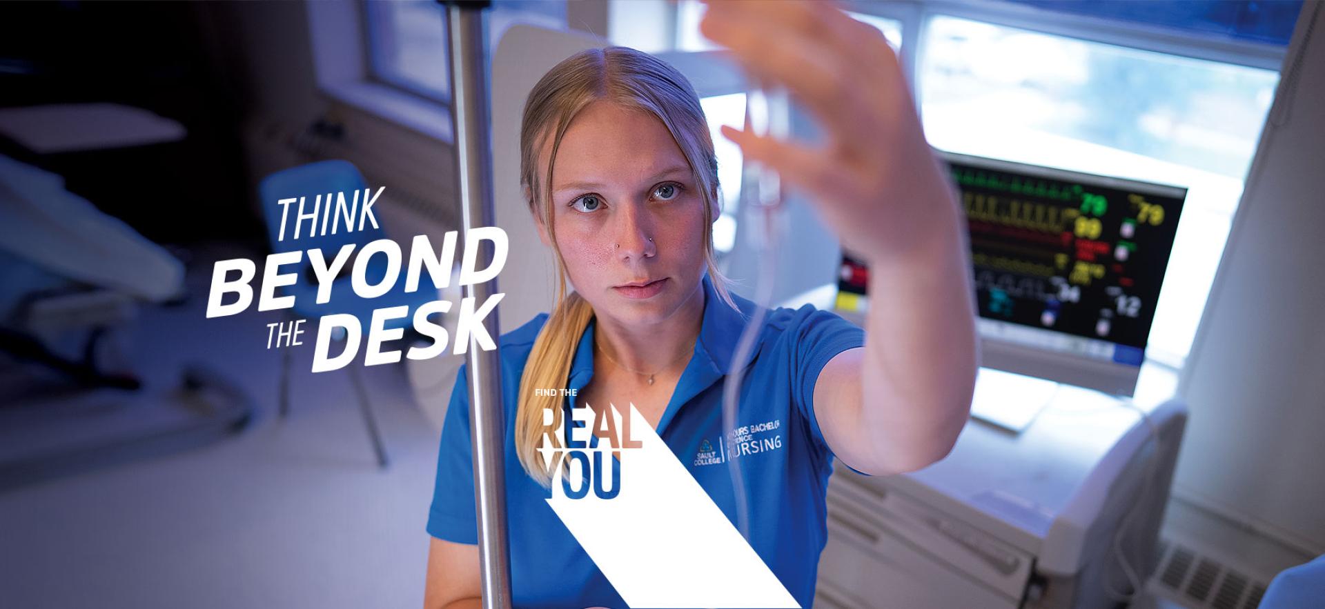 student nurse looking up at IV